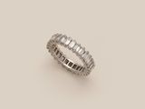a white gold ring with baguets of diamonds
