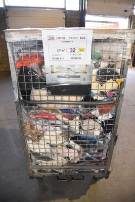 a metal cart with a lot of items inside of it