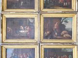 six framed paintings of a family gathering in a wooded setting