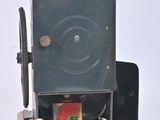 a small camera that is sitting on top of a wooden stand