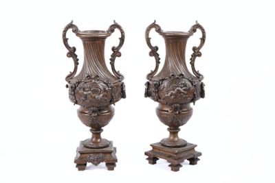 two vases that are sitting on top of each other