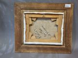 an old picture frame with a message written on the inside of it