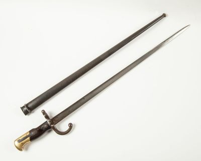 a pair of two swords on a white surface