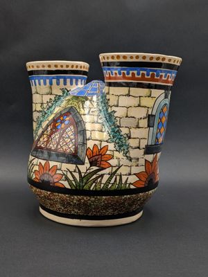 two vases sitting side by side on a table