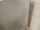 an image of a stainless steel dishwasher sitting on a pallet