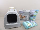a cat sitting in a litter box next to a bag of cat litter