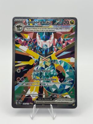 a close up of a pokemon card on a white surface