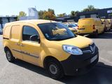 a small yellow van parked in a parking lot