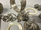 a lot of silver items that are on a table
