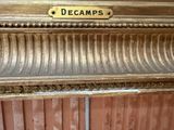 a sign that says decamps on the side of a door