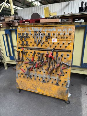 a yellow workbench with many different tools on it
