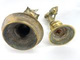 pair of antique brass candlesticks on a white background