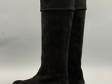 a pair of black sued boots on a white background