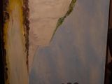 a picture of a painting on a shelf in a room