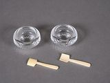 two glasses of water and a toothbrush on a table