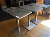 two tables that are sitting on top of a hard wood floor