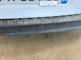 a sticker on the back of a white car