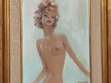 une peinture à l'huile représentant une femme nue, dans un cadre doré