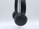 a close up of a pair of headphones on a stand