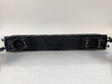 a close up of a black train car on a white surface