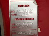 a sign on the side of a red door