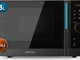 un gros plan d'un four à micro-ondes sur lequel est apposé un autocollant représentant un grill