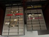 many different watches in the drawer of a drawer