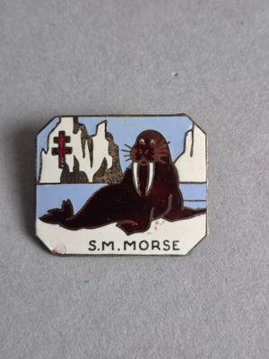 un petit insigne sur lequel figure un waline
