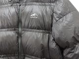 the back of a black jacket with a hood on a hanger