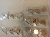 a lot of different types of coins on display