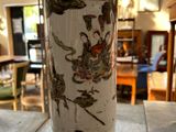 a vase sitting on a table in the middle of a room
