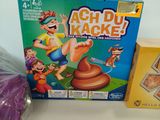 a box of game and a bag of candy sitting on a table