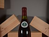 a bottle of wine that is sitting on a table