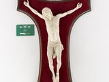 an image of a crucifix hanging on a wall next to a green card