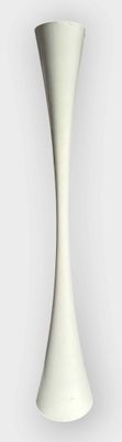 a white vase that is sitting on a table