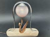 a lamp that is sitting on top of a wooden stand