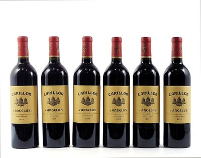 six bottles of red wine lined up in a row on a white surface