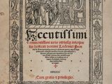 un vieux livre sur lequel figure l'image d'un homme et d'une femme dans une pièce