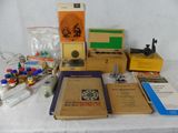 a table with a bunch of books and other items on it