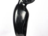 sculpture of a black bird on a marble base
