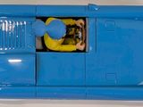 a blue toy car with a man in the driver ' s seat
