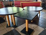 two tables that are sitting in the middle of a restaurant
