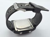 a close up of a watch on a white surface
