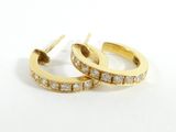 pair of diamond hoop earrings on white background