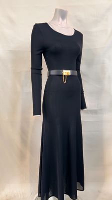 a black dress with a gold belt on a mannequin