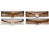 three pieces of metal are shown in a row on a white surface