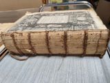an old book sitting on top of a table