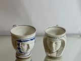 two cups that are sitting on a glass table