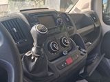 a dashboard of a car with a steering control