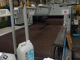 a conveyor belt in a factory with a lot of items on the conveyor belt